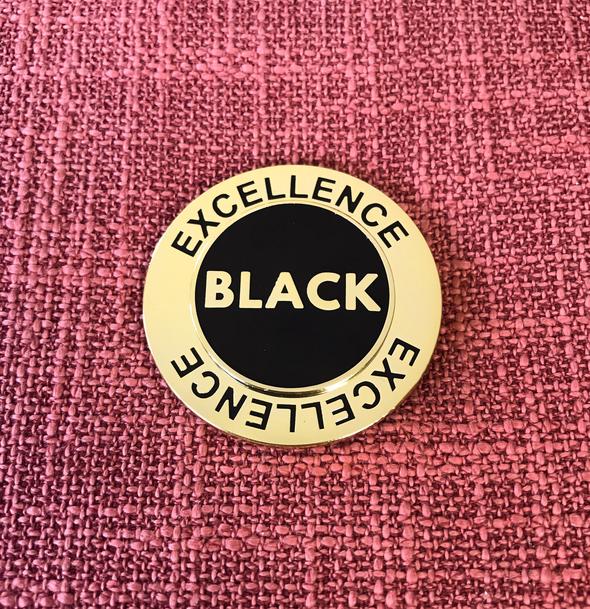 Black Excellence Spinner Pin